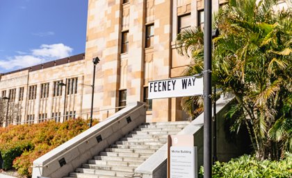 Feeney Way sign in front of building